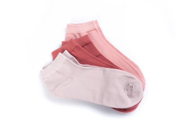 istock several Pairs of colored cheerful short socks on a white background, top view 1286750796