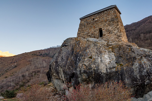 View of ancient stone Tower Fortress Amirkhan-Kala in Kabardino-Balkaria, Russia on autumn day