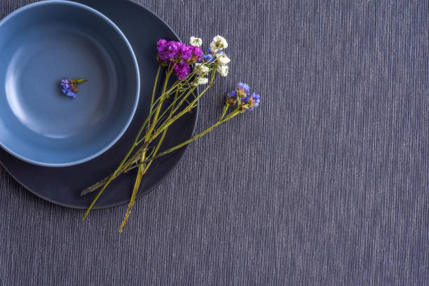 istock Home decoration - grey tableware, plate and bowl, with dry flowers 1286753400