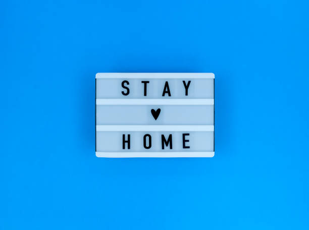 istock Light box with Stay home quote on a blue background. 1286754180