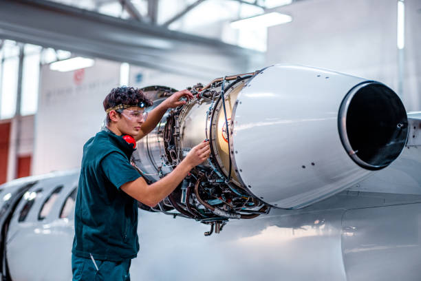 istock Airplane mechanic checking jet engine of the airplane 1286754271