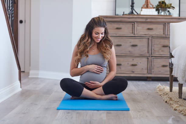 istock Baby is momma's workout buddy today 1286754288
