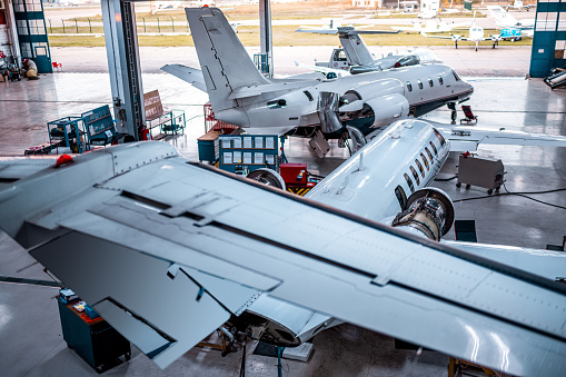 The private airplanes seen in the hangar during the maintenance and checks before the flights.