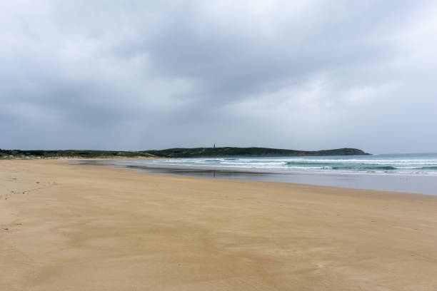 istock Valdovino beach and lighthouse in Galicia 1286754429