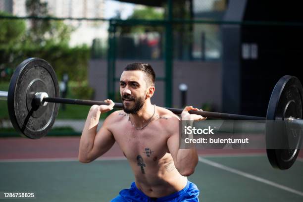 Man Working Bodybuilding By Lifting Weights Barbell Stock Photo - Download Image Now