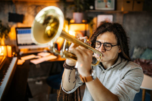 istock Giving online trumpet playing lessons 1286758901