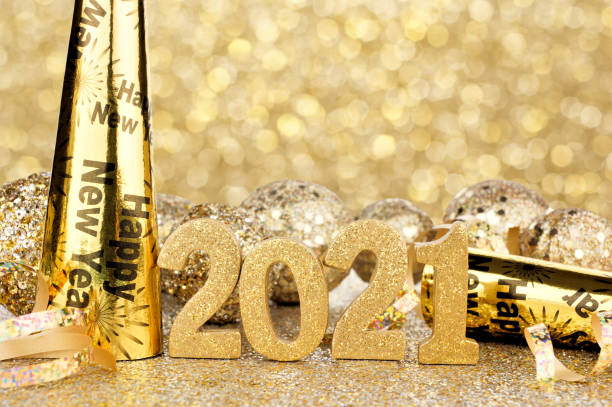 istock New Years 2021 gold numbers and decor with twinkling light background 1286758927