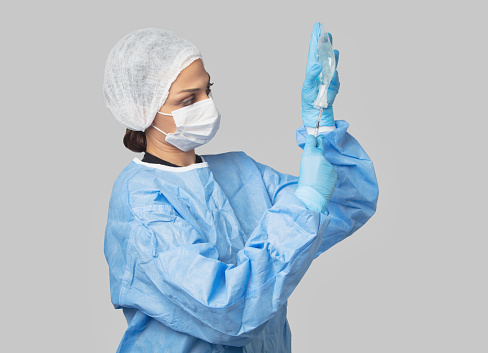Hands in medical rubber gloves, clean background