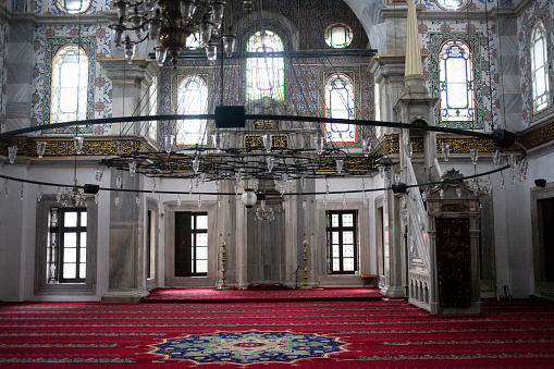 Konya, Turkey- May 13,2022: People praying at Aziziye Mosque, traditional Ottoman architecture in Konya, Turkey