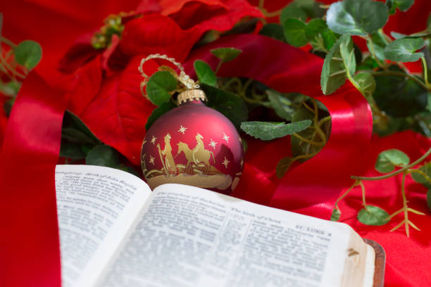 istock Nativity Red Christmas Ornament with Open Bible. 1286760909