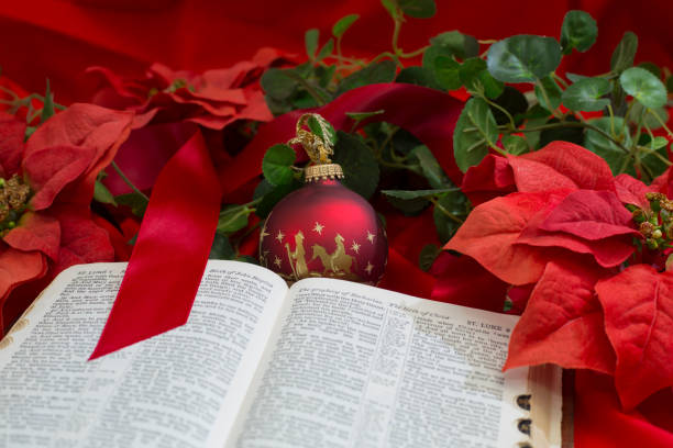 istock Nativity Red Christmas Ornament with Open Bible. 1286760920