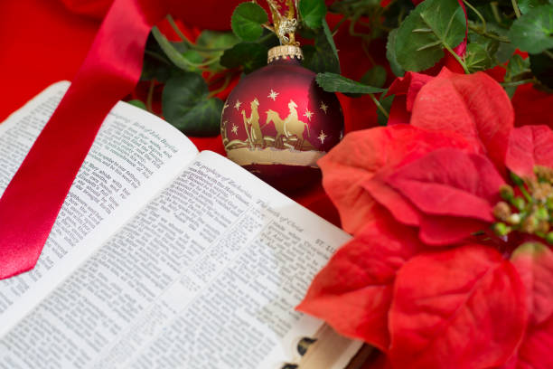 istock Nativity Red Christmas Ornament with Open Bible. 1286760922
