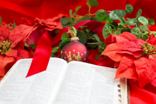 istock Nativity Red Christmas Ornament with Open Bible. 1286760928