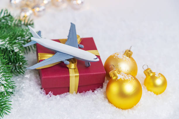 istock Travel for Christmas. Airplane with Christmas decor. Selective focus.Holiday 1286764251