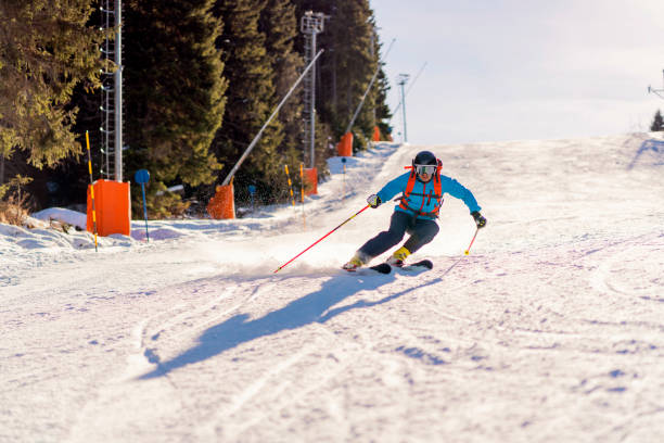 istock Professional skier on the ski slope, making a perfect turn 1286765189