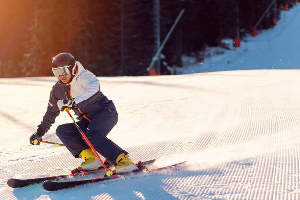 istock Male skier making a turn on powder slope 1286765255