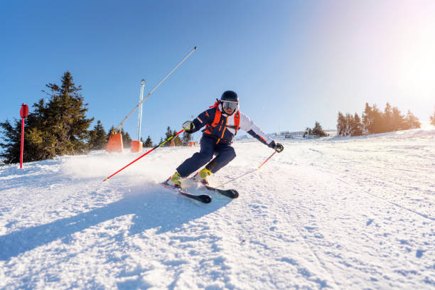 istock Young man skiing down the the mountain 1286765308