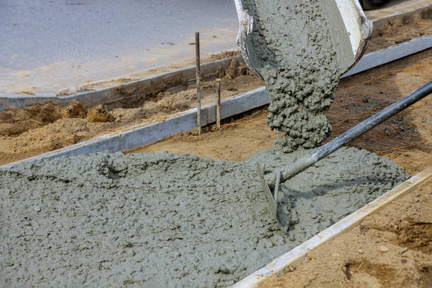 istock Cement of sidewalk a new building under construction 1286768250