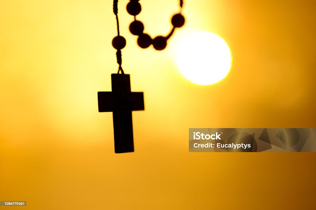 Rosary, holy cross Rosary, holy cross. Sunshine in background. Krakow in Poland. No people. Close shot. Religion Stock Photo