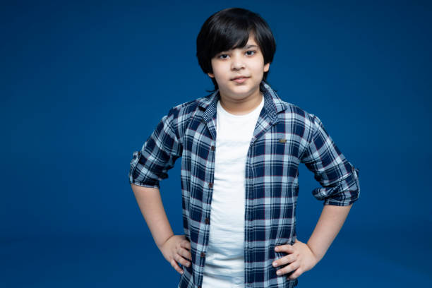 istock Boy at blue background - stock photo 1286771802
