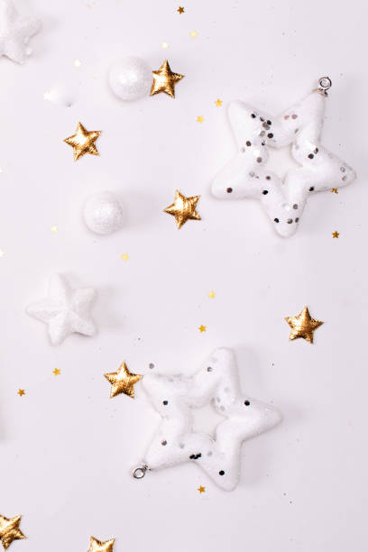 istock Christmas background with decorations and gift boxes on the gray textured board 1286772194
