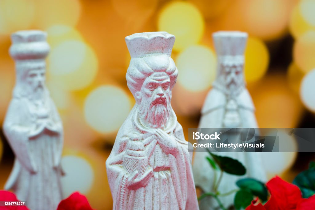 Three Wise Men, Kings bringing gifts to Jesus. Three Wise Men, Kings, bringing gifts to the Baby Jesus.  
Today, wise men still seek Him and celebrate His birth.
Lights out of focus in background. Epiphany - Religious Celebration Stock Photo