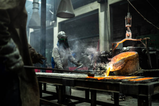 istock Metal industry work - pouring molten metal 1286777734