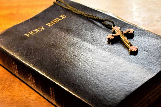 istock Holy Bible With Cross Closeup 1286778415