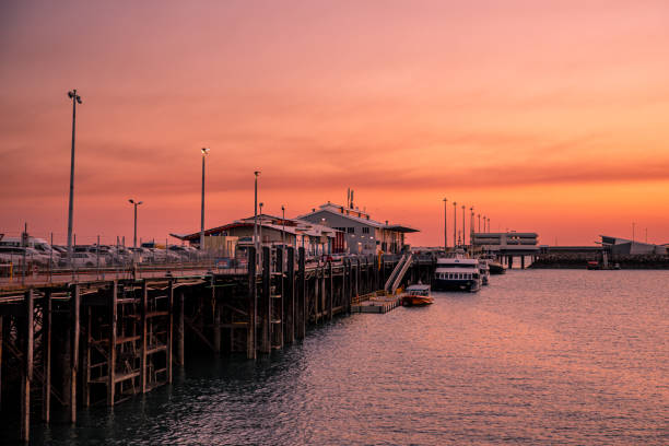 Darwin Waterfront Sunset Darwin, Australia - August 25, 2020: Sunset over the Stokes Wharf and the Waterfront precinct in Darwin, the most northerly of the Australian capital cities in the Northern Territory. darwin nt stock pictures, royalty-free photos & images