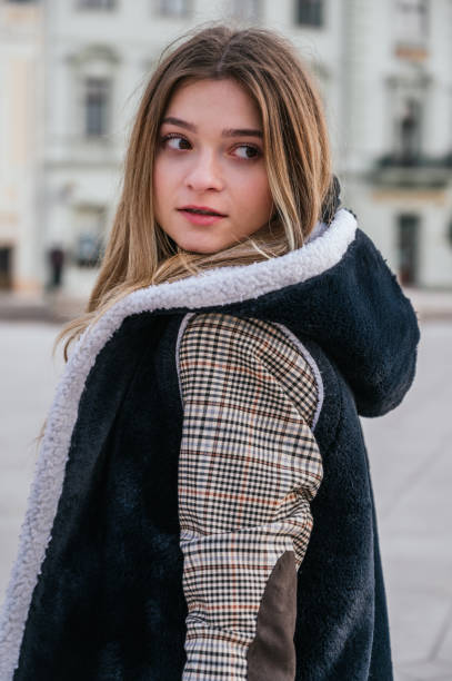 istock Beautiful young woman in winter clothes 1286785253
