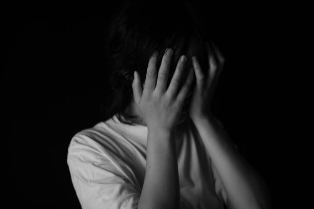 istock Woman covering her face with her hands 1286801184