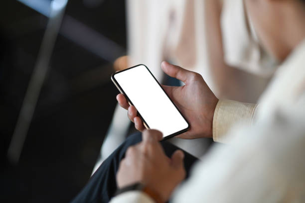 istock Image of man hands are holding and touch on empty screen mobile phone at office. 1286801784