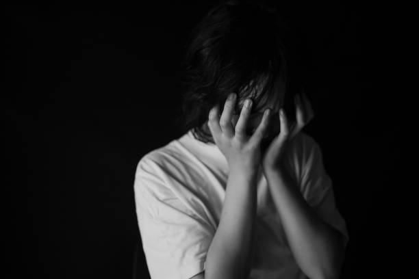 istock Woman covering her face with her hands 1286801945