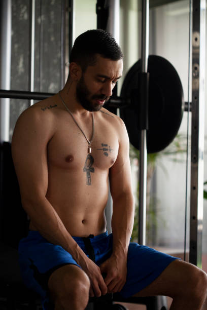 istock man running bodybuilding by lifting weights 1286802026