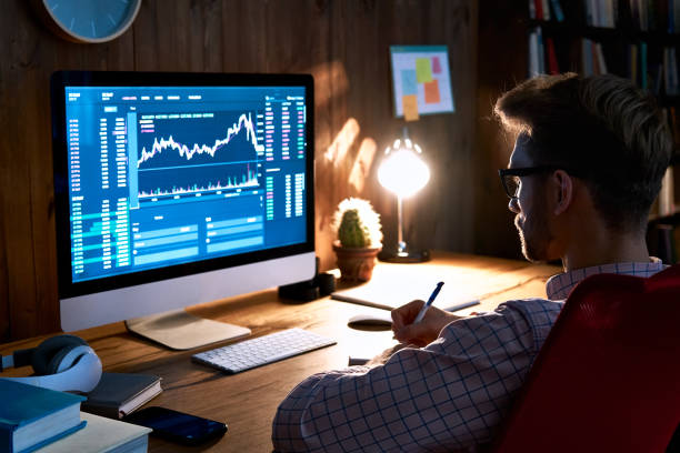 istock Business man stock exchange trader broker looking at pc computer screen, investor manager analyzing financial chart trading online investment data price crypto currency market graph, managing risks. 1286802138