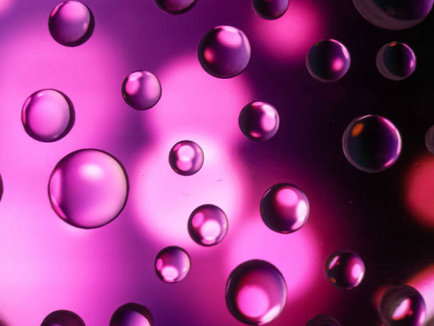 istock Purple Waterdrop Macro Shoot Close Up 1286805568