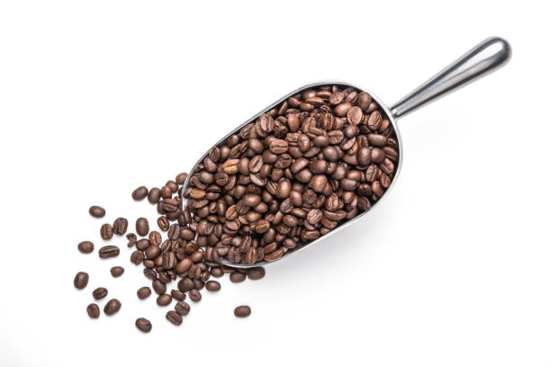 istock Spoon Coffee scoop and coffee beans roasted on a white background 1286808215