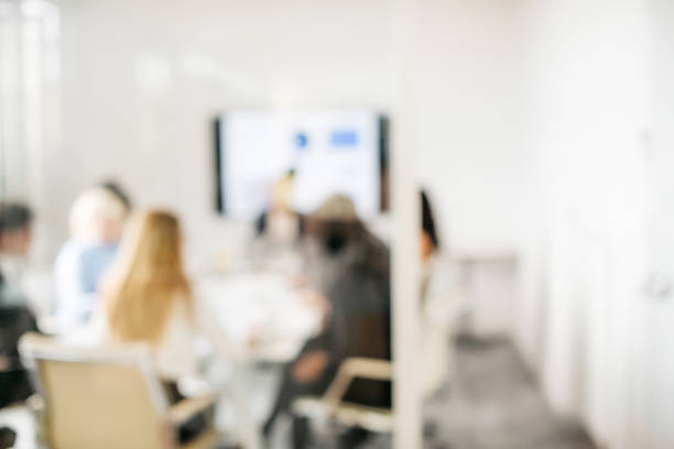 istock Blurred group of bussiness people having a meeting 1286809174