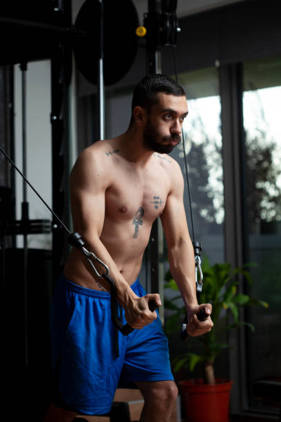 istock man running bodybuilding by lifting weights 1286809197