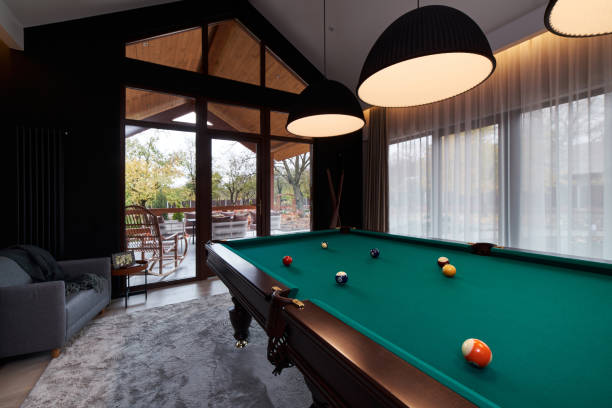 istock modern billiard room with a beautiful table and large windows 1286809867