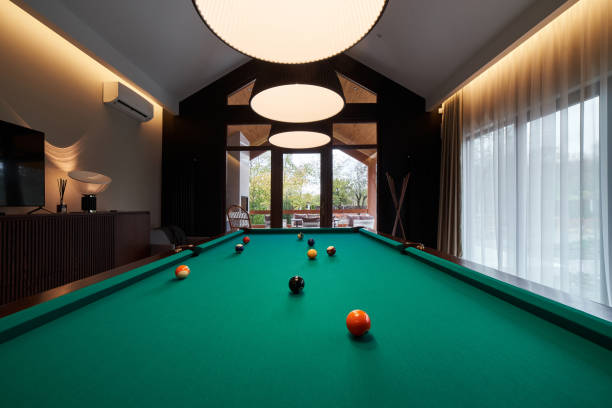 istock modern billiard room with a beautiful table and large windows 1286809868