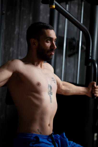 istock man running bodybuilding by lifting weights 1286809962