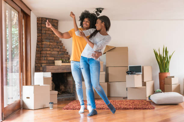 istock afro couple dancing in living room. 1286810076