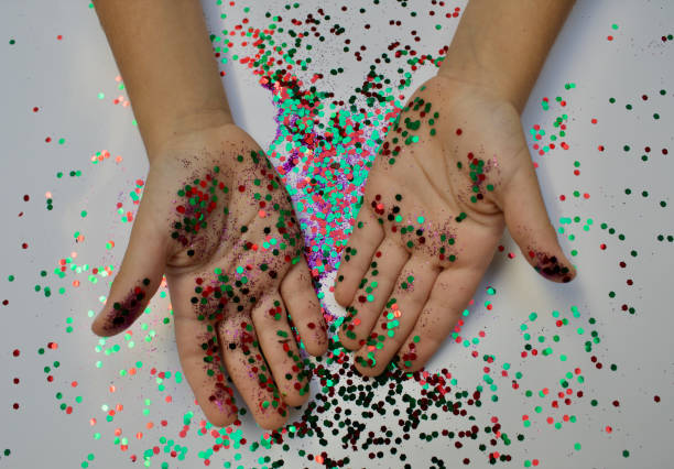 istock Colorful glitter on kids hands 1286813939