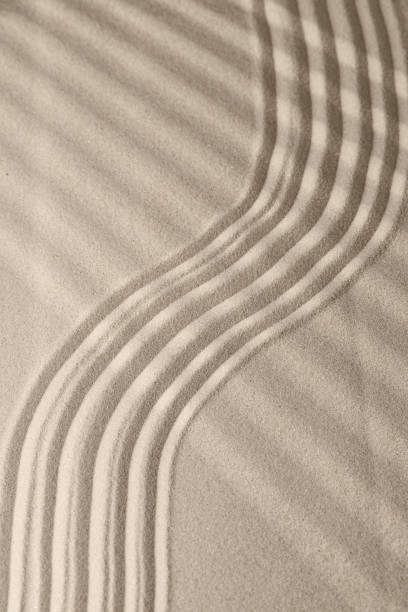 istock Sand surface texture with smooth lines and shadows, for relaxation and spiritual harmony 1286817443