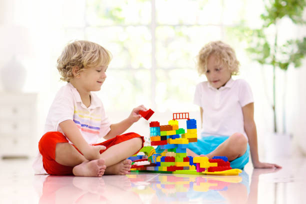 istock Child playing with toy blocks. Kids play. 1286817509