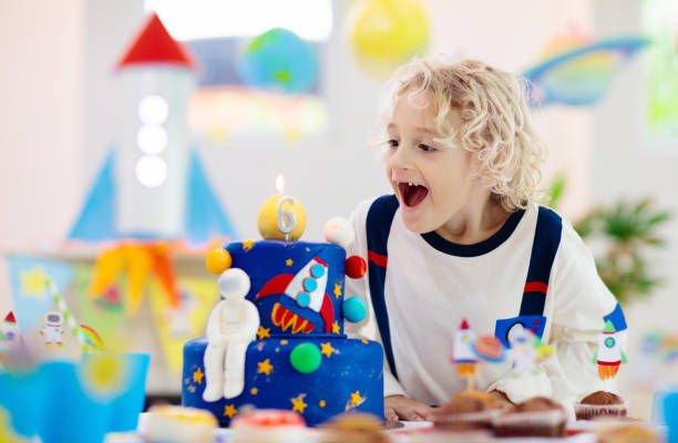 istock Kids space theme birthday party with cake. 1286818151