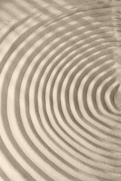 istock Sand surface texture with smooth lines and shadows, for relaxation and spiritual harmony 1286818157