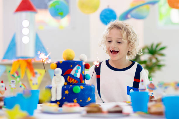 istock Kids space theme birthday party with cake. 1286818350