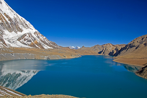 The highest lake in the world, at almost 5,000 meters of altitude, Tilicho Lake, reflects a snow-covered mountain in its blue waters.
Annapurna Range, Nepal Himalayas